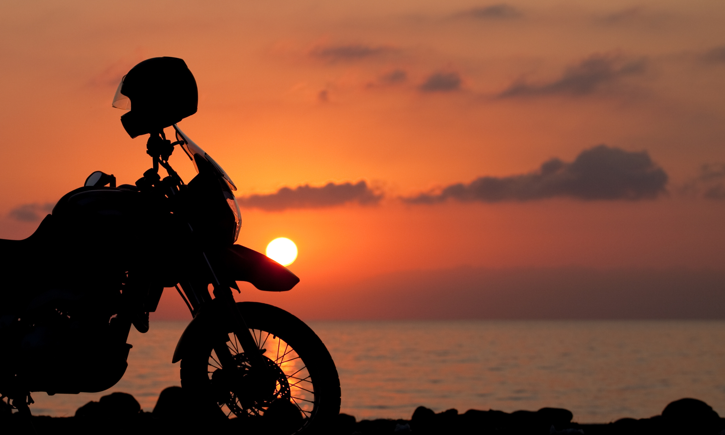 Texas motorcycle rider stopping to view the sunset and avoid a Houston motorcycle accident